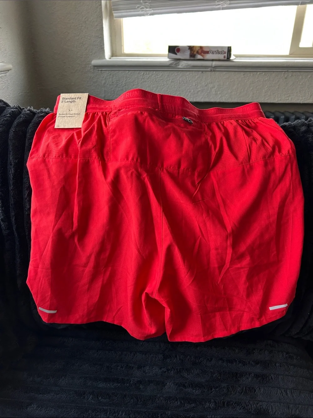 Nike Men's Red Athletic Shorts with Black Trim and White Swoosh